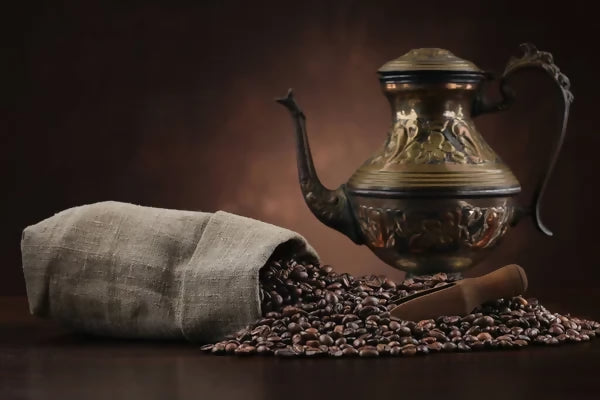 depositphotos_468085240-stock-photo-arabic-kettle-coffee-beans-burlap