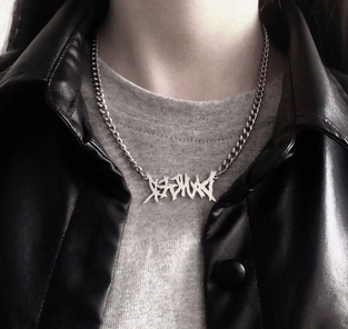 Necklace with a phrase pendant