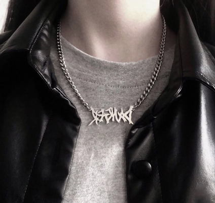 Necklace with a phrase pendant