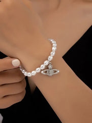 Women's star-shaped rubber bracelet with a spherical design made of artificial pearls and rhinestones in the shape of an eye