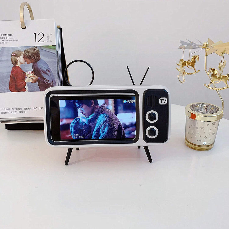 Mobile Phone Screen Stand. with Speaker Function. It can be Connected by Bluetooth or by Wire. Without The Screen Magnifier Function. But More Practical Than a Screen Magnifier. A Smart Gift for